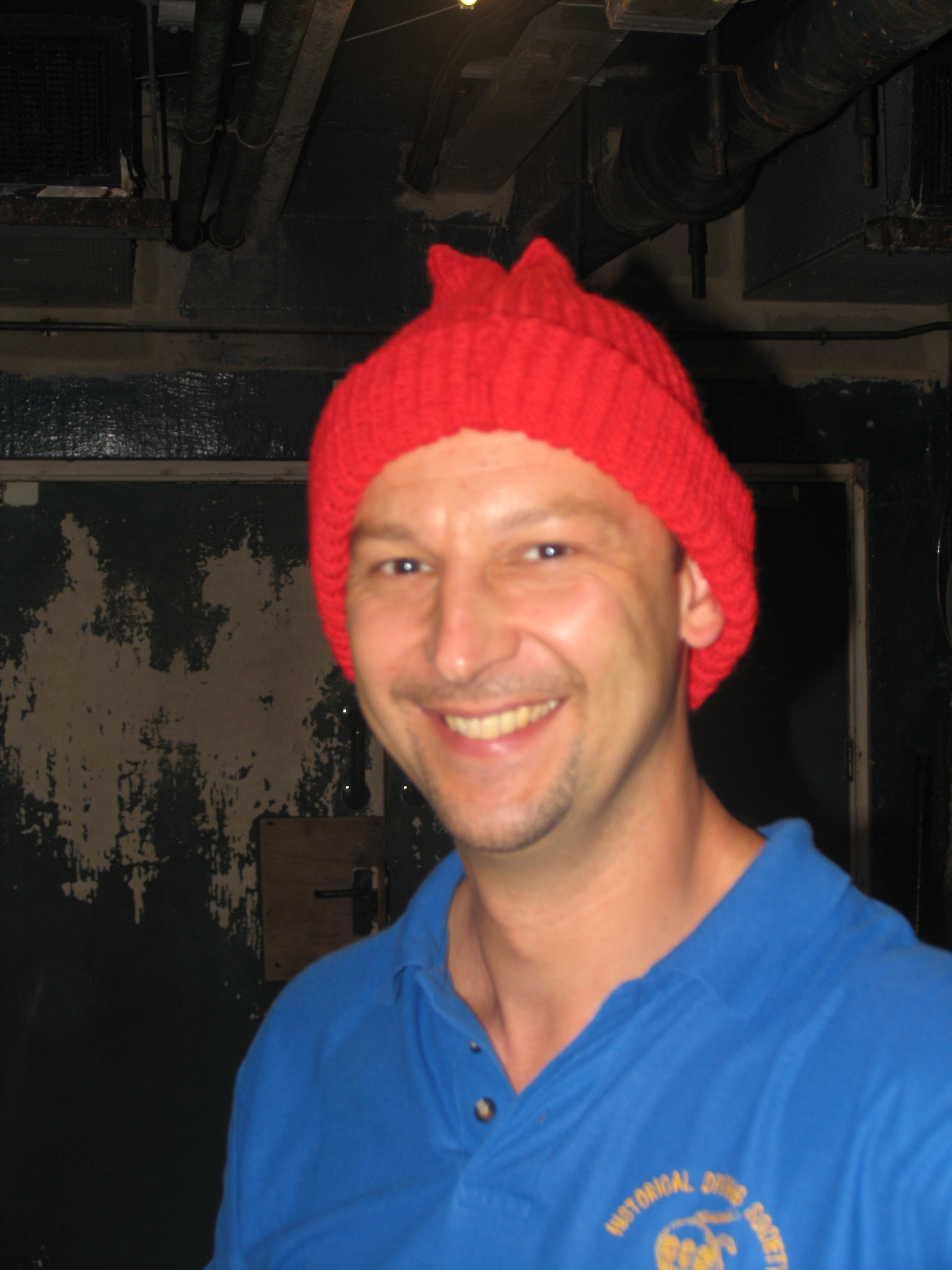 Gary modelling red "William Walker" hat